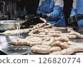 Close up of sausages production process at the meat factory. 126820774