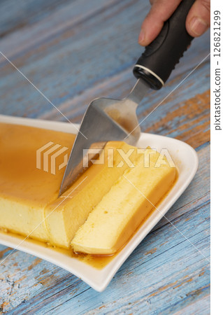 Cream caramel pudding with caramel sauce on a plate, Flan 126821299