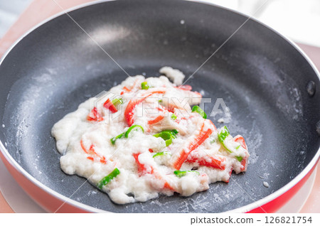 White stir-fry made with crab sticks and egg whites 126821754