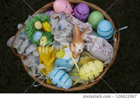 Easter basket with decorative eggs and bunny figurine. Easter basket with decorative eggs and bunny figurine. 126822067
