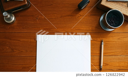 Art photo of desk with paper. Candlelight warms the wood, smooth texture. Art photo of desk with paper. Candlelight warms the wood, smooth texture. 126822942