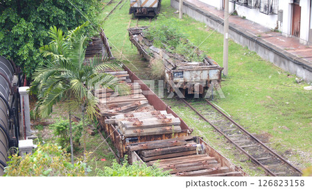 Kuala Lumpur, Malaysia, April 12, 2015: Old Freight Train Cars on Rusty Tracks 126823158