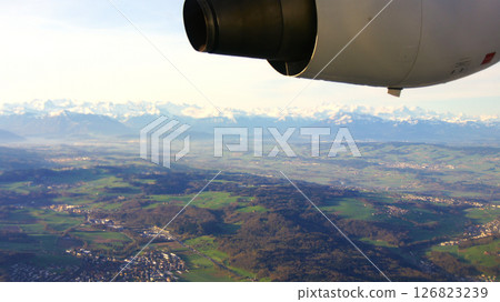 Zurich, Switzerland, April 15, 2015: BAe 146 Wing View over Swiss Landscape 126823239
