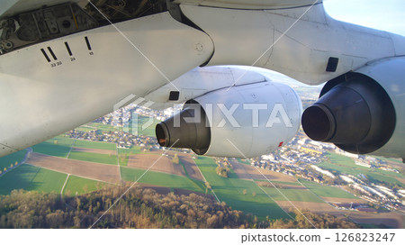 Zurich, Switzerland, April 15, 2015: BAe 146 Wing View over Swiss Landscape 126823247