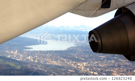 Zurich, Switzerland, April 15, 2015: BAe 146 Wing View over Swiss Landscape 126823248