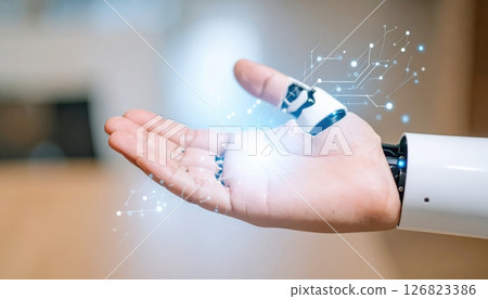 Human hand holding a small futuristic robot with holographic digital interface and technology elements 126823386