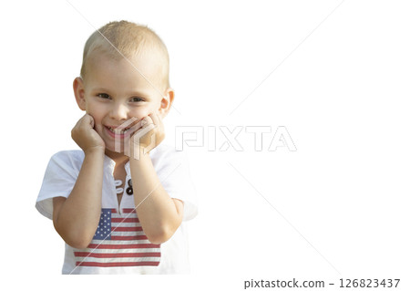 Little boy in clothes with a print of the American flag isolated on a white background. Little boy in clothes with a print of the American flag isolated on a white background. 126823437