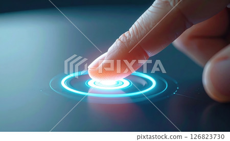 Close-up of a finger touching a futuristic glowing digital interface on a tablet device with holographic effects 126823730