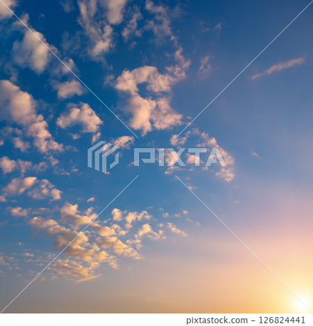 Sunset with bright sun, blue sky and pink clouds 126824441