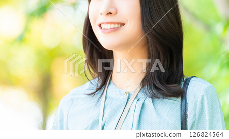Smiling woman/businesswoman standing outdoors Smiling woman/businesswoman standing outdoors 126824564