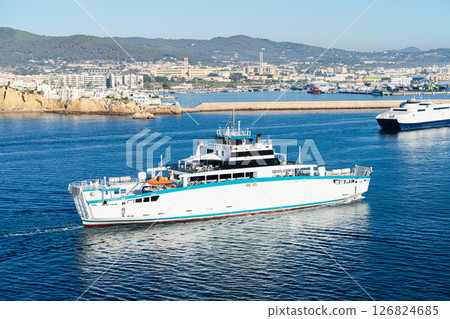 White ferry departing Ibiza harbor on a sunny day 126824685