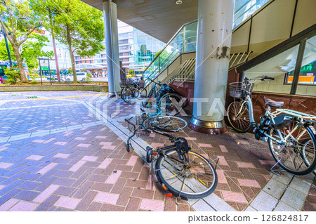 Yokohama cityscape in Japan Strong winds... An abandoned bicycle was lying down under the "Yokohama West Exit First Pedestrian Bridge" at the west exit of Yokohama Station, where the wind was strong. Yokohama cityscape in Japan Strong winds... An abandoned bicycle was lying down under the "Yokohama West Exit First Pedestrian Bridge" at the west exit of Yokohama Station, where the wind was strong. 126824817