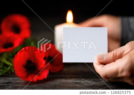 Poppy Flowers and Blank Card with Burning Candle Poppy Flowers and Blank Card with Burning Candle 126825375