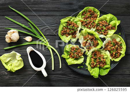 Fresh and Crispy Ground Chicken lettuce wraps Fresh and Crispy Ground Chicken lettuce wraps 126825595