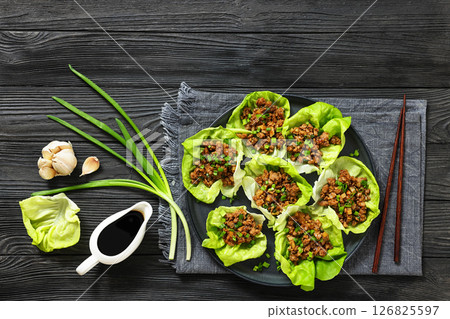 Fresh and Crispy Ground Chicken lettuce wraps 126825597