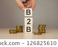 b2b on the background of stacks of money coins 126825610