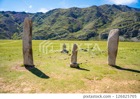 Vertical stone slabs known as Inin steles forming a sacred site near Chuysky Trakt Altai Russia. Spiritual monument used for prayers and worship by Altai people Vertical stone slabs known as Inin steles forming a sacred site near Chuysky Trakt Altai Russia. Spiritual monument used for prayers and worship by Altai people 126825705