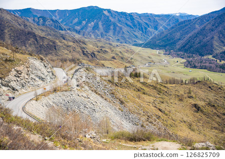 View of Chuysky Trakt valley from Chike Taman pass Altai Russia. Panoramic mountain valley landscape in Siberian region. 126825709