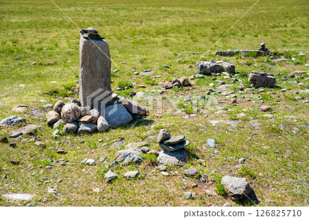 Vertical stone slabs known as Inin steles forming a sacred site near Chuysky Trakt Altai Russia. Spiritual monument used for prayers and worship by Altai people Vertical stone slabs known as Inin steles forming a sacred site near Chuysky Trakt Altai Russia. Spiritual monument used for prayers and worship by Altai people 126825710