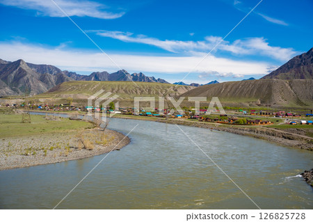 Small settlement Maly Yaloman on the bank of Katun River Altai Russia. Rural village nestled in Siberian mountain river valley. 126825728