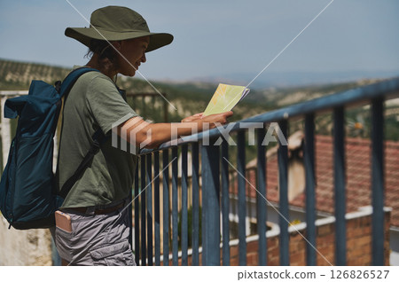 Traveler Exploring the Charm of Cazorla, Spain With a Map in Hand Traveler Exploring the Charm of Cazorla, Spain With a Map in Hand 126826527
