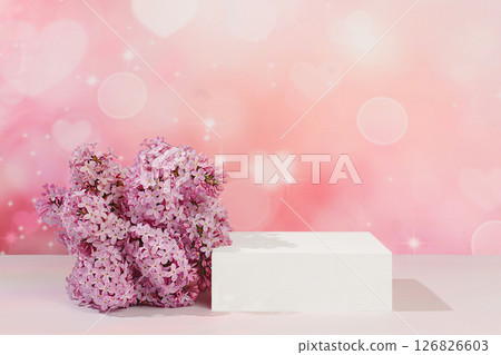 Empty podium with spring lilac flowers.Abstract floral arrangement with lilac flowers, banner. Creative template for your design.Minimal modern aesthetics, elegant beauty concept Empty podium with spring lilac flowers.Abstract floral arrangement with lilac flowers, banner. Creative template for your design.Minimal modern aesthetics, elegant beauty concept 126826603