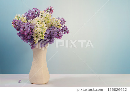 Abstract floral arrangement and banner for screen.Still life with beautiful spring flowers blooming white lilac in vase on elegant background,floral holiday card with summer greeting concept 126826612