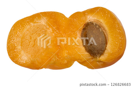 Close-up of ripe apricot with pit showing bright orange flesh and texture of fruit, isolated background Close-up of ripe apricot with pit showing bright orange flesh and texture of fruit, isolated background 126826683