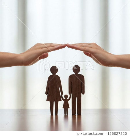 Family safety, hands that create a roof over silhouettes. Family safety, hands that create a roof over silhouettes. 126827220