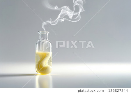A glass bottle with smoke and yellow liquid. Space for text. 126827244