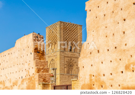 Hassan Tower ancient incomplete mosque minaret and surrounding walls, Rabat, Morocco Hassan Tower ancient incomplete mosque minaret and surrounding walls, Rabat, Morocco 126828420
