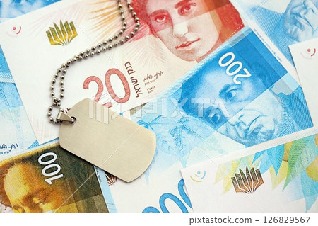 Israel New Shekels banknotes and military token. The current Israel money bills and dogtags Israel New Shekels banknotes and military token. The current Israel money bills and dogtags 126829567