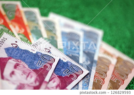 Pakistan rupees banknotes on glitter green background. The current Pakistan money bills Pakistan rupees banknotes on glitter green background. The current Pakistan money bills 126829593
