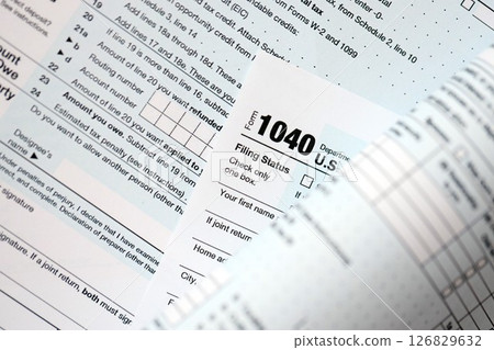 1040 US individual income tax return form blank close up. Few pages of united states tax blank 126829632