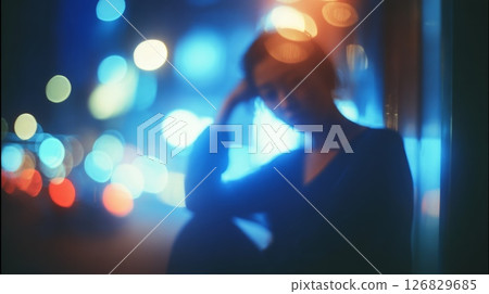 Silhouette profile in vibrant night cityscape. Neural network AI generated 126829685