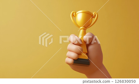 Hand holding a golden trophy cup on a yellow background, symbolizing victory and achievement. Success and award concept 126830050
