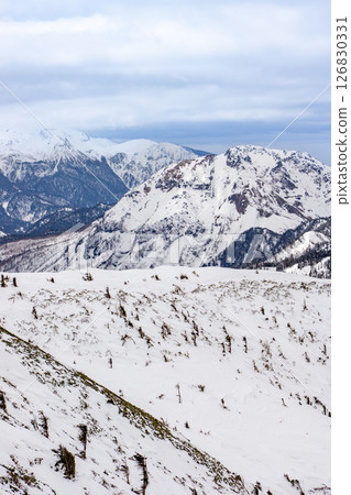 Mt. Norikura and Mt. Yakedake seen from Mt. Nishihomaruyama. Climbing Mt. Dokubetsu in the snowy season 126830331