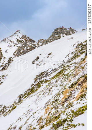 Pyramid Peak and Dokubyou of Nishihotakadake. Climbing Dokubyou snow mountain of Nishihotakadake in the remaining snow season. Pyramid Peak and Dokubyou of Nishihotakadake. Climbing Dokubyou snow mountain of Nishihotakadake in the remaining snow season. 126830337