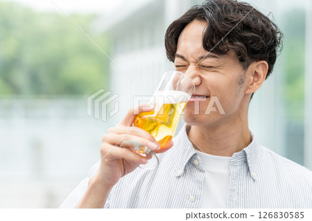 A man drinking delicious beer. A man drinking delicious beer. 126830585