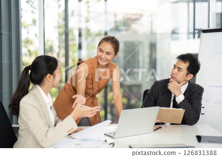 Business Meeting. Professionals collaborating in a modern office setting. 126831388