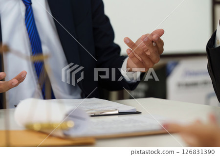 Legal Dialogue and Persuasion. A lawyer articulating a point during a discussion, emphasizing the importance of communication in the legal field. Legal Dialogue and Persuasion. A lawyer articulating a point during a discussion, emphasizing the importance of communication in the legal field. 126831390