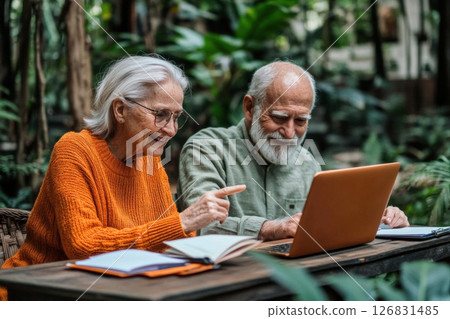 Elderly couple engaged in online learning lush indoor garden digital interaction cozy atmosphere joyful discovery 126831485