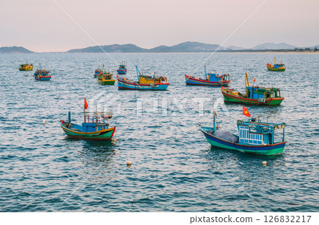 Vietnamese fishing boats and vessels sail in the sea in bay 126832217
