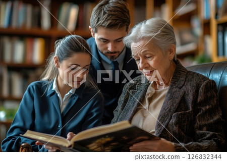 Family bonding momentgrandmother reading with grandchildren in cozy library setting intimate family interaction warm atmosphere 126832344