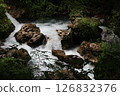 river flowing through rocks 126832376