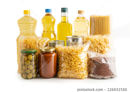 Foodstuff for donation isolated on white background with clipping path, storage and delivery. Various food, pasta, cooking oil and canned food in cardboard box. Foodstuff for donation isolated on white background with clipping path, storage and delivery. Various food, pasta, cooking oil and canned food in cardboard box. 126832588