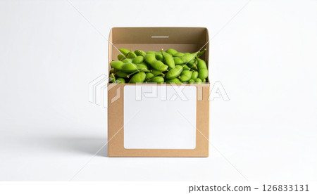 Cardboard box filled with fresh green edamame beans on white background 126833131