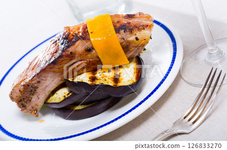 Baked pork rib served with cheese 126833270