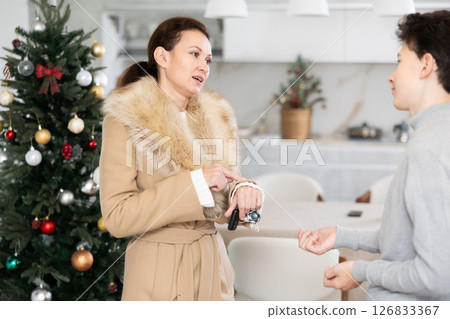 Mother leaving house, son staying home 126833367