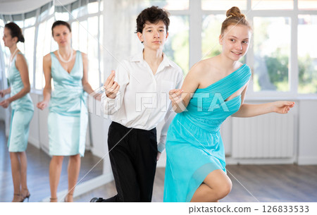 Motivated couple of teen dancers practicing vigorous Lindy Hop 126833533